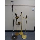 Four brass rise and fall standard lamps (continental wiring)