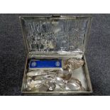 An embossed Macintosh tin containing quantity of plated spoons,