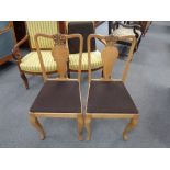 A set of twelve oak dining chairs (one lacking cushion)