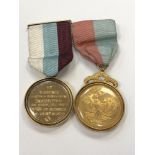A silver gilt mounted Masonic medal and one other