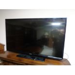 A Hitachi 42 inch LCD TV with remote