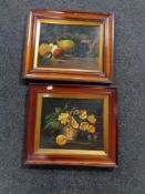 A pair of early twentieth century mahogany framed still life oils on panels