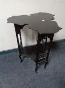 An Arts & Crafts ebonised occasional table