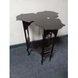 An Arts & Crafts ebonised occasional table