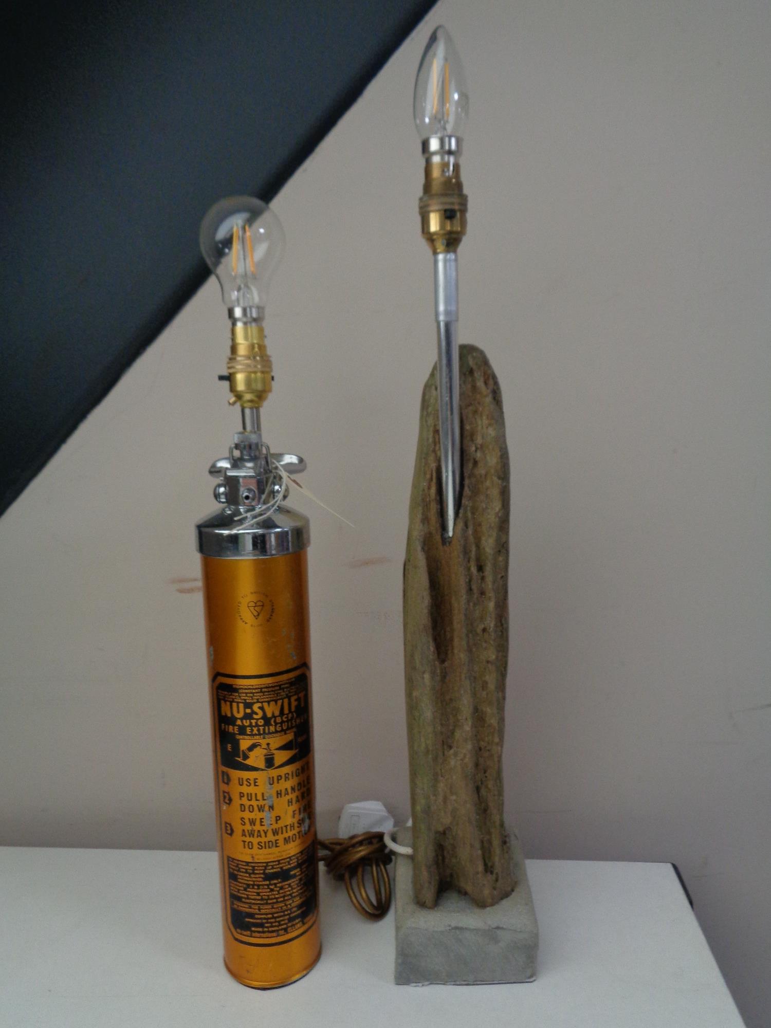 A vintage Nu-swift fire extinguisher converted to a table lamp together with a drift wood table