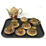 A suite of Royal Worcester hand painted gilt coffee china decorated with fruit,