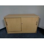 A pine effect double door office sideboard