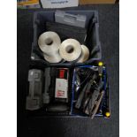 A box of assorted power tools,