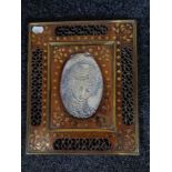 An Eastern brass inlaid photograph frame