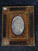 An Eastern brass inlaid photograph frame