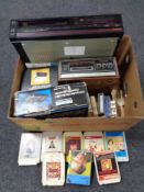 A box of Samsung video cassette recorder, Kyoto S600 eight track player with cassettes,