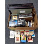 A box of Samsung video cassette recorder, Kyoto S600 eight track player with cassettes,