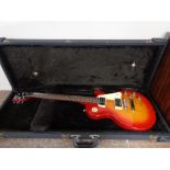 An Epiphone Les Paul electric guitar in hard shell case
