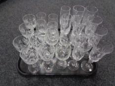A tray of crystal, champagne flutes,