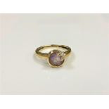 A 9ct gold diamond set amethyst ring, size N.