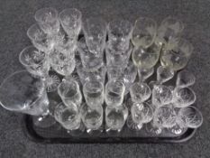 A tray of glass, crystal decanters,