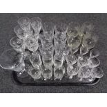 A tray of glass, crystal decanters,