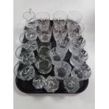 A tray of glass, crystal whisky glasses, candle holders,
