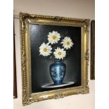 An oil on canvas - Flowers in a vase , framed.