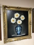 An oil on canvas - Flowers in a vase , framed.