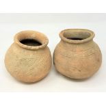 Two ancient terracotta pots, believed to be Thai, height 13 cm.