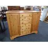 A ducal pine double door bedroom chest fitted with six central doors