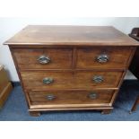 A George III mahogany four drawer chest on bracket feet