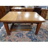 An Edwardian oak dining table