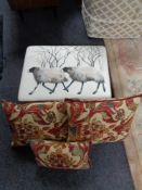 A contemporary footstool upholstered in sheep patterned print together with three tapestry style