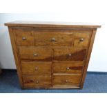 An Eastern hardwood nine drawer chest