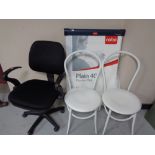 A swivel office chair together with a Nobo flip chart stand and two white metal tubular chairs