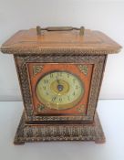 A late nineteenth century Junghans mantel clock with brass and enamelled dial