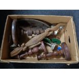 A box of wooden pieces, candlesticks, tribal bowl,