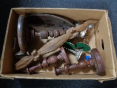 A box of wooden pieces, candlesticks, tribal bowl,