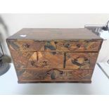 A Japanese mixed wood parquetry six drawer table chest