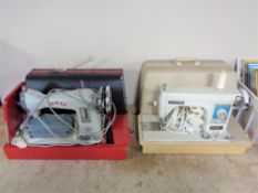 Two cased twentieth century electric sewing machines by Jones and New home