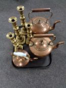 A tray of three antique copper kettles,