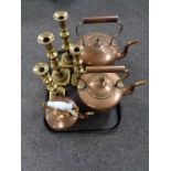 A tray of three antique copper kettles,