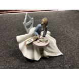 A Nao figure - Seated lady with cat