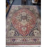 A fringed woolen Persian carpet