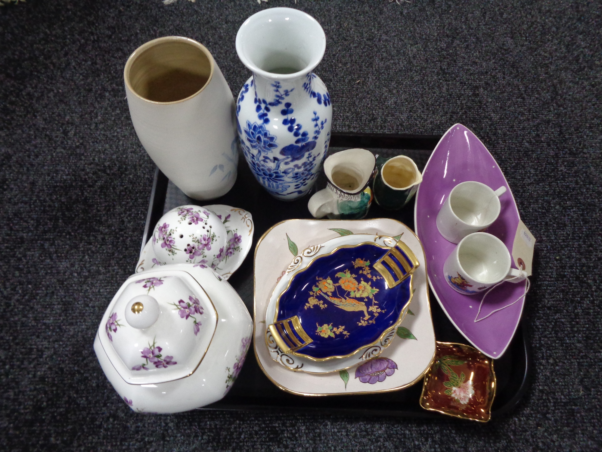 A tray of assorted china, character jugs, Carlton ware dish, Royal Winton bowl,