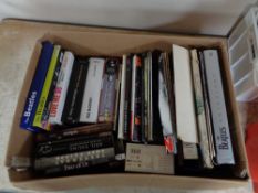 A box of books and magazines relating to the Beatles