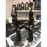 A pair of Spelter figures - Man and Lady riding eagles on wooden bases