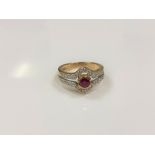 A 9ct gold diamond and ruby ring, size L/M.
