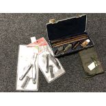 A cased gun cleaning kit,