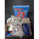 A box of tea cards and albums, vintage badges, die cast vehicles, tin badges,