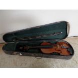 A twentieth century violin and bow in coffin case