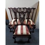 A set of six reproduction hardwood dining chairs comprising of two carvers and four singles