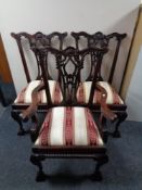 A set of six reproduction hardwood dining chairs comprising of two carvers and four singles