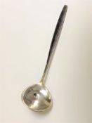 A George Jensen silver ladle